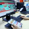 E-commerce and digital platforms with payment functions will have to declare and pay taxes on behalf of sellers from April 1, 2025. (Photo: VNA)