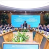 老挝人民革命党中央检查委员会高级代表团造访越南投资发展股份商业银行。图自越通社