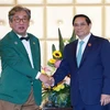 El primer ministro de Vietnam, Pham Minh Chinh, recibe al presidente del Comité de Crecimiento Verde y Neutralidad en Carbono de Corea del Sur, Kim Sang-huyp. (Fuente: VNA)