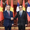 El presidente de Vietnam, To Lam, y el primer ministro de Laos, Sonexay Siphadone. (Fuente: VNA)