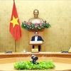 Премьер-министр Фам Минь Тьинь председательствует на заседании правительства по вопросам законотворчества 13 июня. (Фото: ВИA)