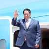 Премьер-министр Фам Минь Тьинь прибывает в город Далянь 24 июня. (Фото: ВИA)