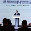 Премьер-министр Фам Минь Тьинь выступает на мероприятии в Сеуле. (Фото: ВИA)