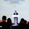 Премьер-министр Фам Минь Тьинь выступает на форуме. (Фото: ВИA)
