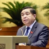 El ministro de Planificación e Inversión de Vietnam, Nguyen Chi Dung, informó sobre el contenido revisado en el proyecto de Ley de Inversión Pública (Fuente: VNA)