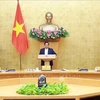 El primer ministro de Vietnam, Pham Minh Chinh preside la reunión ordinaria del Gobierno (Fuente: VNA)