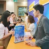 Des entreprises et des représentants d’Amazon discutent des moyens de commercialiser les produits vietnamiens dans le monde grâce au commerce électronique. Photo : hanoimoi.vn