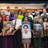 Remise des portraits des martyrs aux familles en juin 2024. Photo: VOV