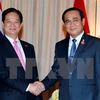 Vietnamese Prime Minister Nguyen Tan Dung (L) and his Thai counterpart Prayuth Chan-ocha (Photo: VNA)