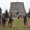J'rai youth perform gongs at a traditional festival.