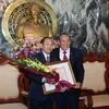 Lao court official awarded with Vietnam’s insignia 