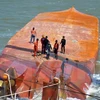 Two sailors of sunken ship on southern river still missing