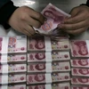Seven Chinese jailed for illegal cash transfers
