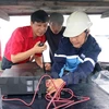 Coastal fishermen presented with communication devices 