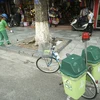 Hanoi trash collectors using bikes