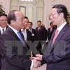 Deputy Prime Minister Nguyen Xuan Phuc meets with Chinese Vice Premier Zhang Gaoli.