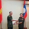 Young Vietnamese, Lao officers join exchange activities