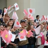 Crowds welcome Japanese Emperor, Empress at Temple of Literature 