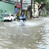 Heavy rain floods some Hanoi streets