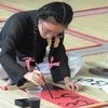 Young artist writes the beauty of Vietnamese calligraphy