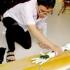 Student invents robotic arm for the disabled