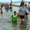 Children having fun in natural swimming pool