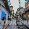 Extreme sport along the “railway” street in Hanoi