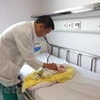 Lao newborn given complicated cardiac surgery by Vietnamese doctors