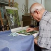 Hanoi's veteran artisan helps promote embroidery craft 