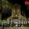 Churches in Hanoi shine brightly to welcome Christmas Eve