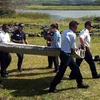 Malaysian investigators probe plane debris for MH370 link