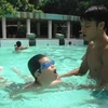 Teachers, children in Vinh Long taught swimming skills