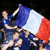 Vietnamese, French football fans celebrate France's World Cup victory