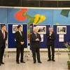 Ambassador Le Dung speaks at the exhibition (Photo: VietnamPlus)