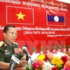 Lao Deputy Defence Minister Chansamon Channhalat delivers addresses the event (Photo: VNA)