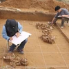 Archaeologists from Vietnam National Museum of History and National Museum of Korea work at the site in 2012. (Photo: Vietnam National Museum of History)