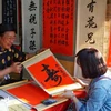 People flock to Temple of Literature for calligraphic works