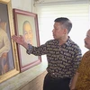 Artist and 2,000 portraits of President Ho Chi Minh