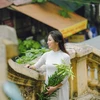 Hanoian lady gracefully poses with easter lily