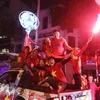 Football fans storm streets to celebrate U23 victory