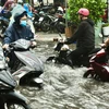 Heavy rain submerges streets in Ho Chi Minh City