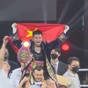 Star boxer wins first world belt for Vietnam