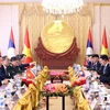 President holds talks with Party General Secretary, President of Laos