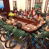 Wheelchairs given to war invalids, disabled people