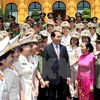 President Tran Dai Quang meets outstanding policewomen