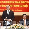 PM visits Vietnam embassy, expatriates in Japan