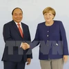 Prime Minister Nguyen Xuan Phuc talks with German counterpart