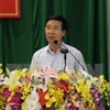 Vietnam, Laos Parties share experience in sustainable development 