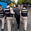 Cambodia arrests nearly 400 suspects over telecoms fraud