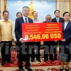 Overseas Vietnamese assist storm victims in Laos